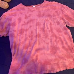 A small short sleeve pink shirt